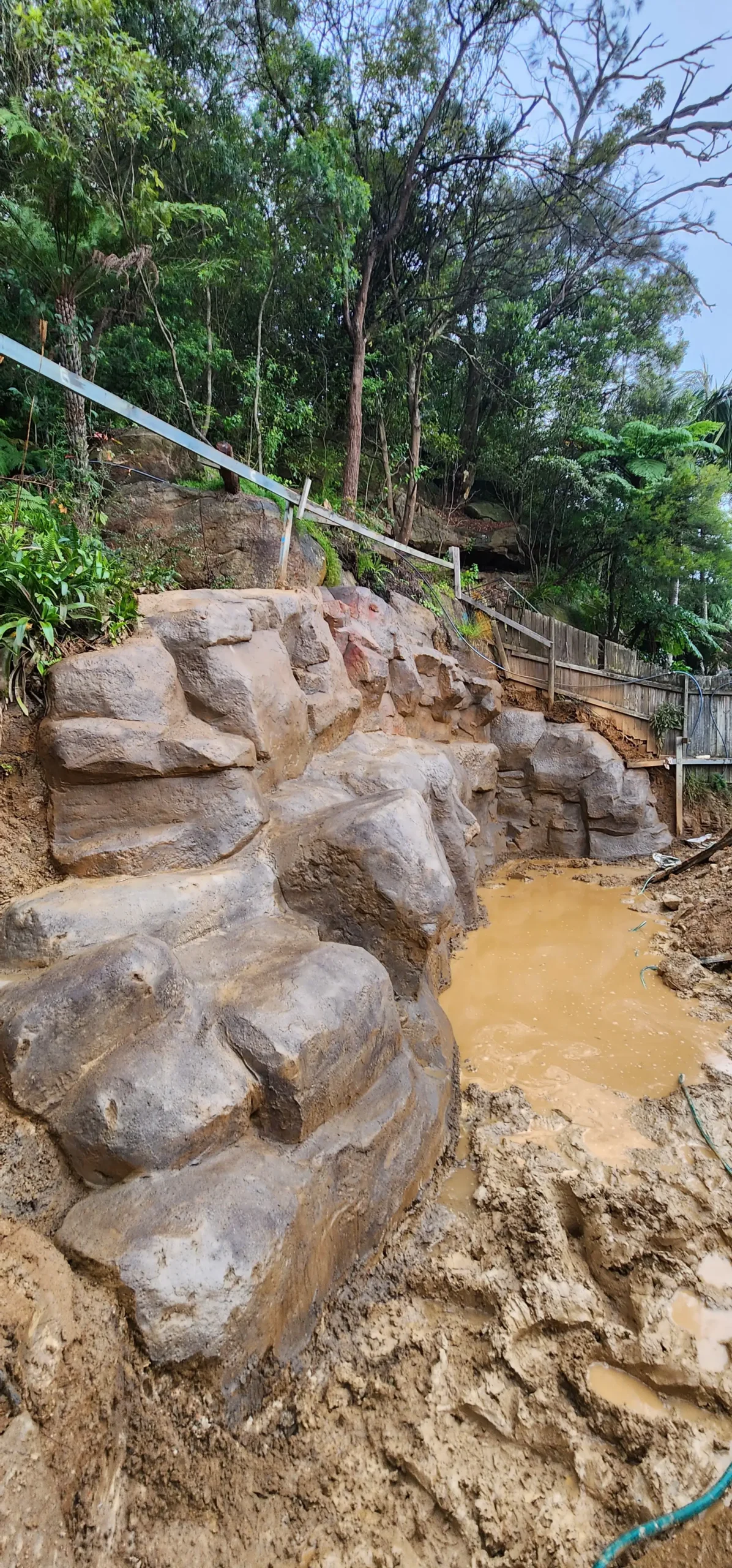 Rocky Slope With Muddy Water Pool